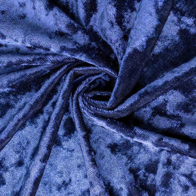 Navy blue velvet fabric texture in a swirling pattern.