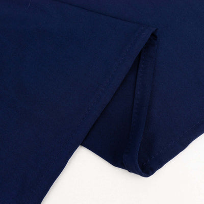 Navy blue cotton fabric with smooth texture and folded edge detail.