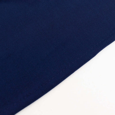 Navy blue fabric with visible stitching detail.