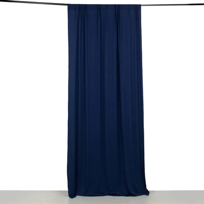 Navy fabric curtain hanging on a rod against a white background