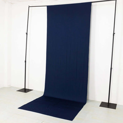 Navy blue backdrop fabric on a studio stand for photography