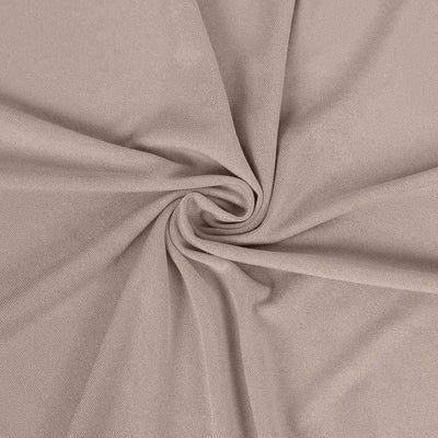 Soft beige fabric close-up with a smooth texture and elegant drape.