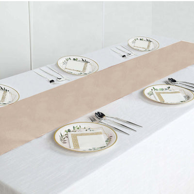 Elegant table setting with beige runner and decorative plates