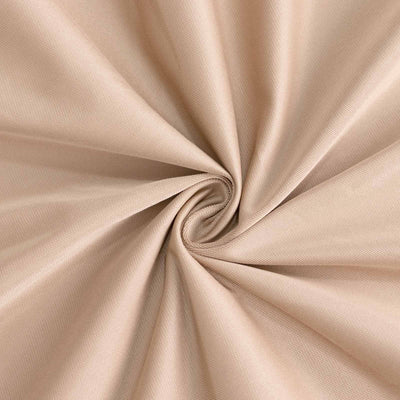 Beige fabric texture in a spiral swirl pattern.