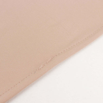 Close-up of soft beige fabric showcasing stitching details.