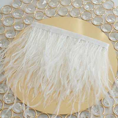 White feather trim on a gold circular base.