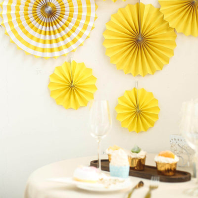 Yellow paper fans decoration for a festive celebration.