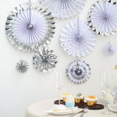 Decorative paper fans in silver and lavender for event decor.
