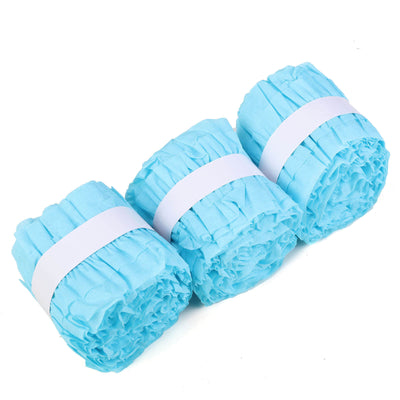 Three rolls of light blue crinkle paper on a white background