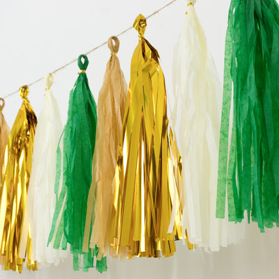 Colorful tassel garland in green, gold, and cream hanging decoratively.