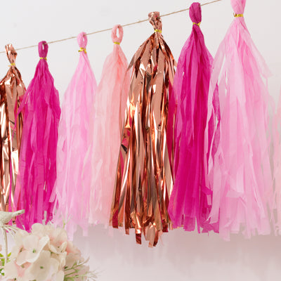 Pink and rose gold party tassel garland for celebrations.