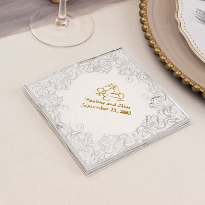 Elegant wedding invitation with gold lettering and ornate silver border.
