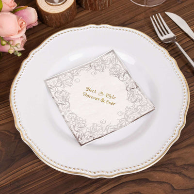 Elegant wedding napkin with gold lettering on a decorative plate.