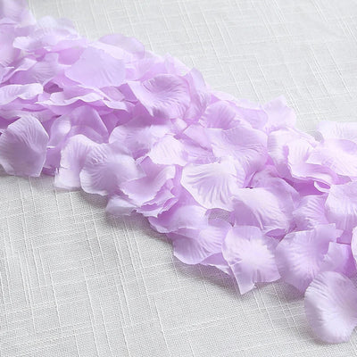 Lavender flower petals on white fabric background