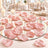 Elegant pink petals on mirrored wedding table centerpiece with candles