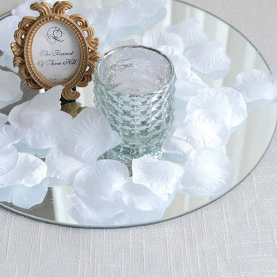 Elegant white rose centerpiece with mirrored tray, glass vase, and gold frame