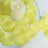 Yellow flower petal candle ring with white pillar candle centerpiece