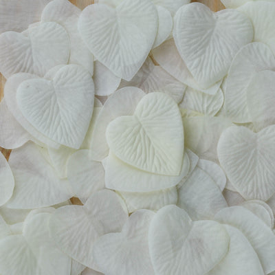 Heart-shaped decorative petals in soft white tones.