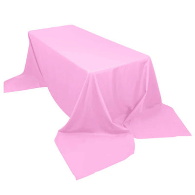 Pink tablecloth on a white backdrop