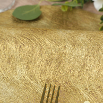 Gold textured table runner with elegant fork on a decorative surface.