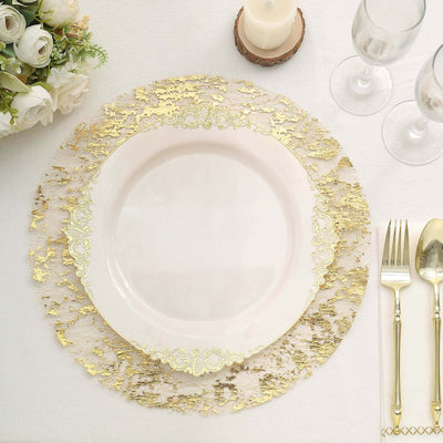 Elegant white plate with gold decorative charger on a dining table setting.