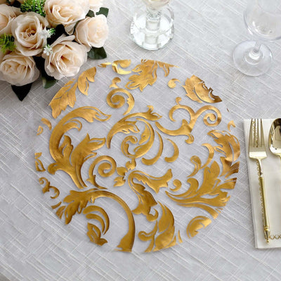 Gold floral lace table overlay on a white tablecloth with elegant dining setup.