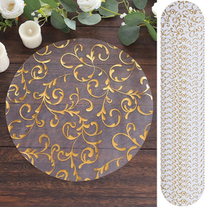 Gold floral design table runner on wooden surface.