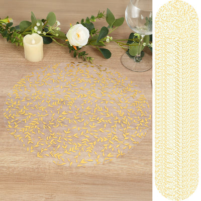 Gold leaf table runner with intricate leaf design on a wooden surface.