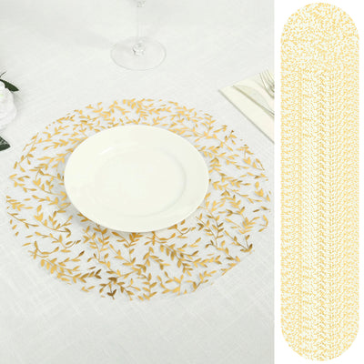 Gold leaf table runner and placemat on a white tablecloth.