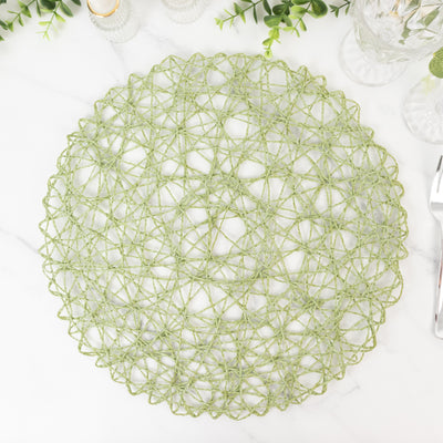 Green decorative placemat with intricate woven design on a marble surface.