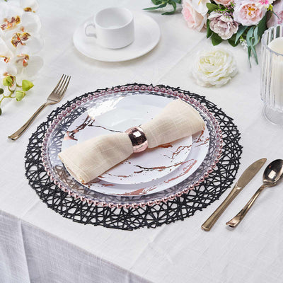 Elegant table setting with a decorative plate, napkin, and cutlery.