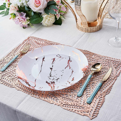 Elegant marble-patterned plate with gold accents on a decorative table setting.