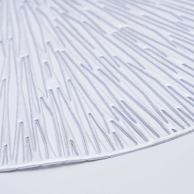Textured silver placemat with a modern design.