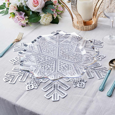 Elegant glass snowflake serving platter on a festive table setting.