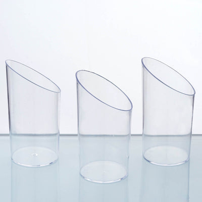 Set of three clear plastic cups with unique angled designs.