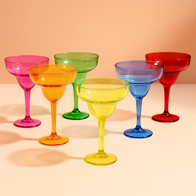 Colorful margarita glasses in vibrant shades of pink, orange, green, blue, and red.