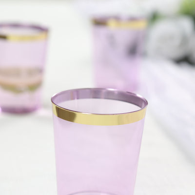 Purple plastic cups with gold rim, perfect for parties and events.