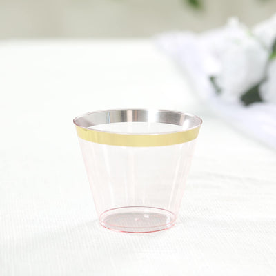 Clear plastic cup with gold accent band