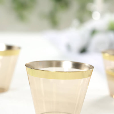 Gold-trimmed clear plastic cups for elegant occasions