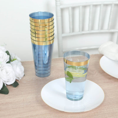 Blue plastic cups with gold rims on a table setting.