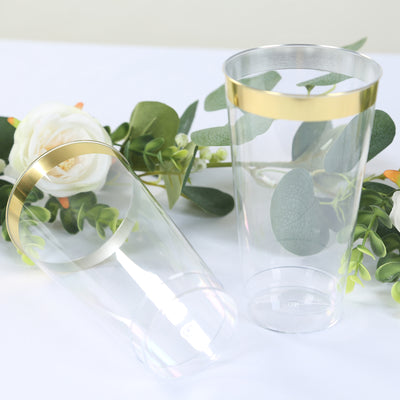 Clear plastic cups with gold bands, perfect for events and celebrations.