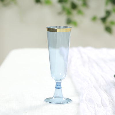 Blue glass champagne flute with gold rim