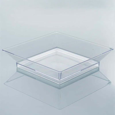 Transparent square acrylic serving tray on a light background