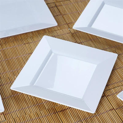 White square plate on a bamboo mat.