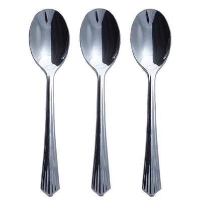 Set of three shiny stainless steel spoons on a white background