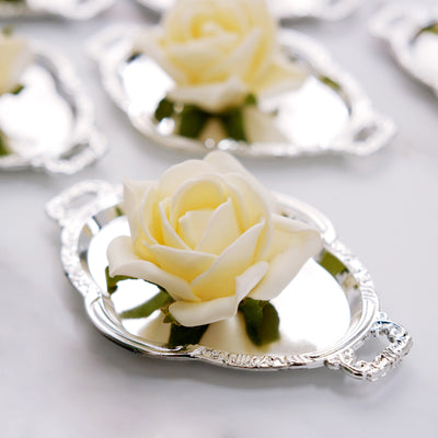 White rose on a silver tray against a neutral background