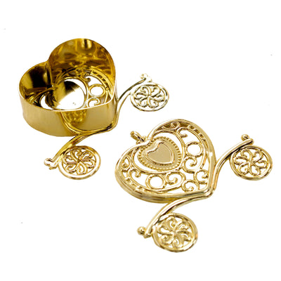 Gold heart-shaped cookie cutters with intricate designs