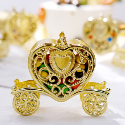 Gold heart-shaped carriage jewelry box with colorful beads inside.