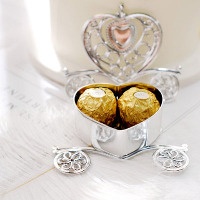 Silver heart-shaped carriage with Ferrero Rocher chocolates inside.