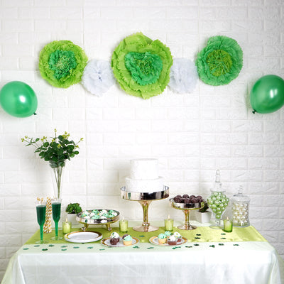 St. Patrick's Day party table with green decorations, cake, and treats.
